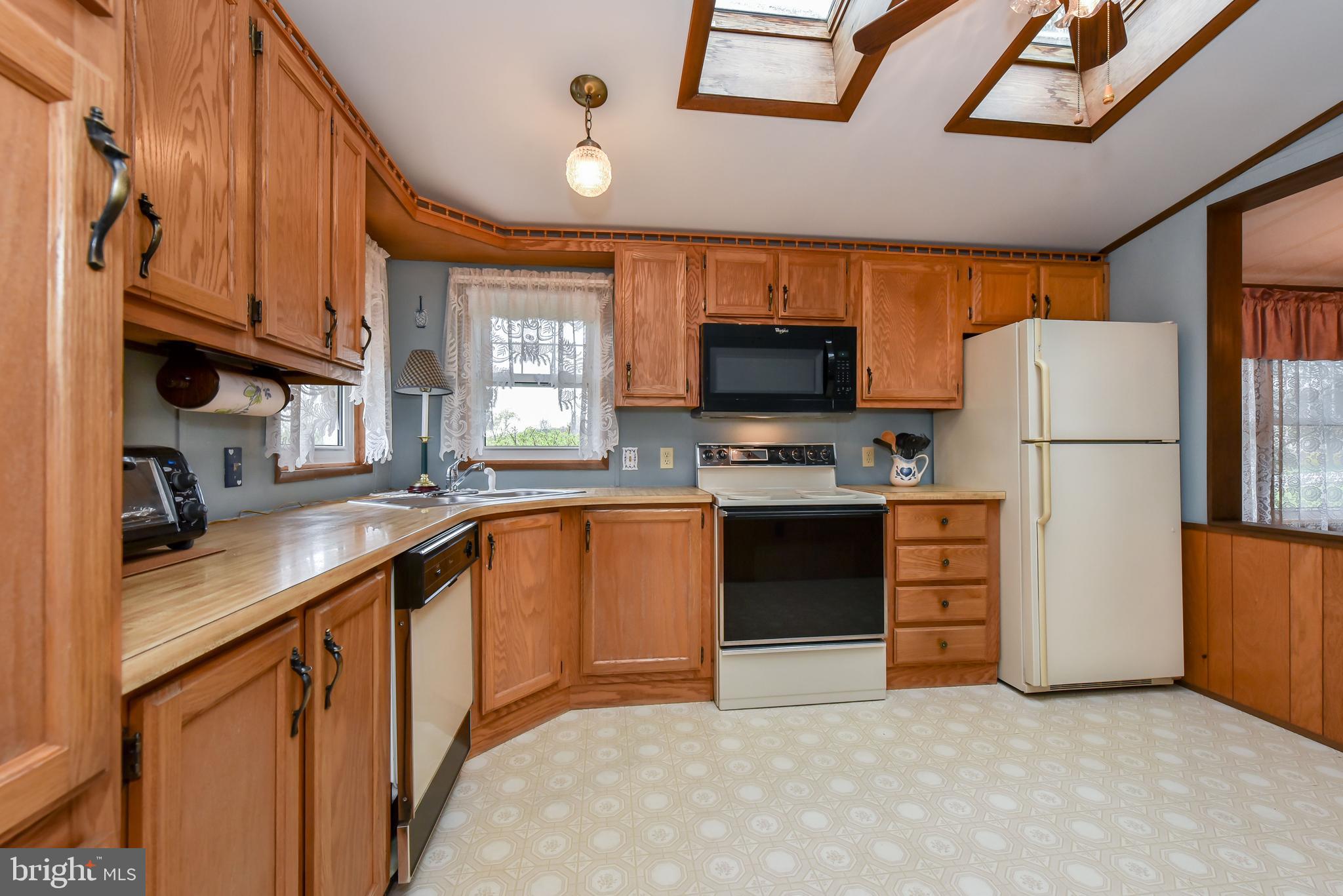 396 Connelly Road Rising Sun, MD 21911 - Photo 14 of 32 SKYLIGHTS MAKE THE KITCHEN BRIGHT