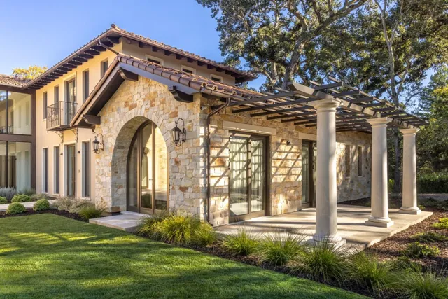 a front view of a house with garden
