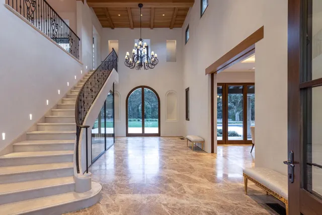 a view of entryway and hall with wooden floor