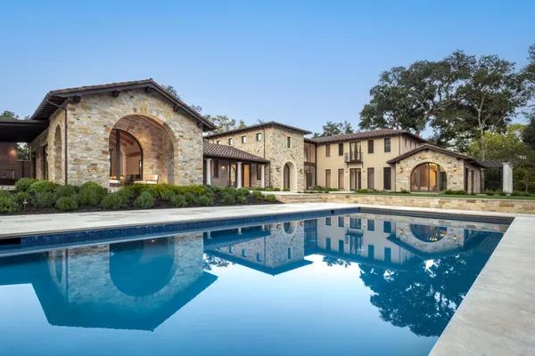 a front view of a house with swimming pool