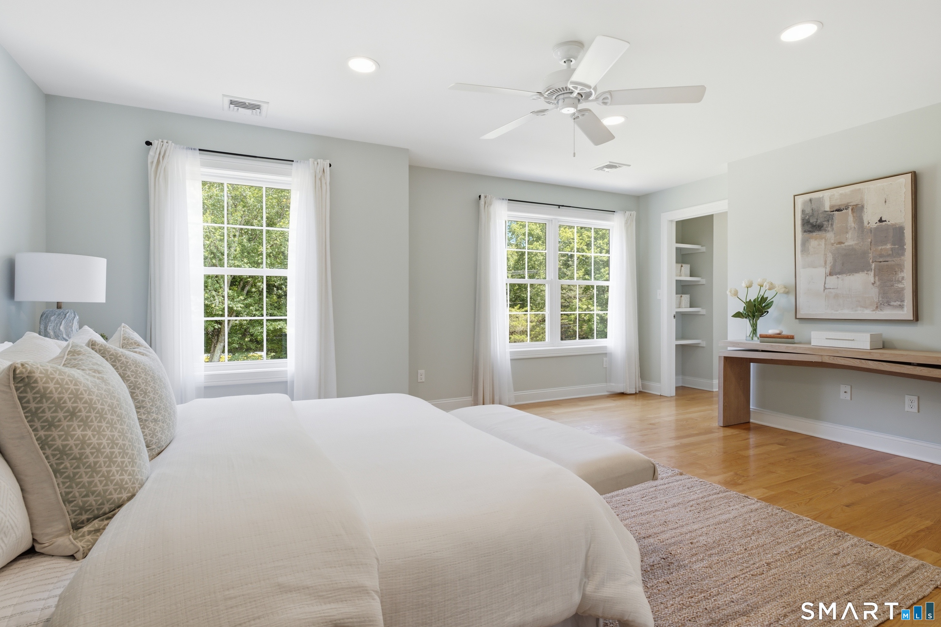 838 Little Meadow Road Guilford, CT 06437 - Photo 16 of 40 The primary bedroom is bright and beautiful with wood floors and another soothing coastal paint color