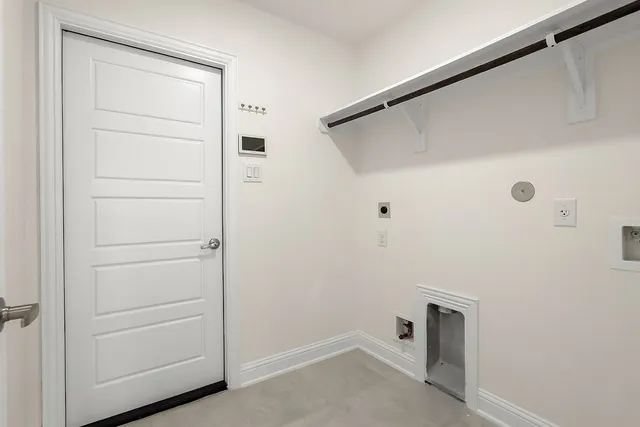 a view of storage and utility room with closet