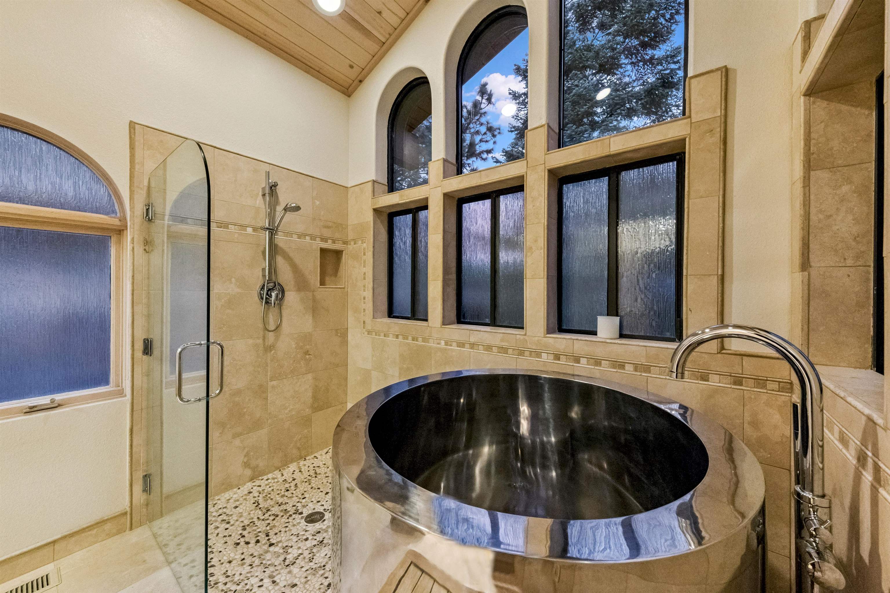 12705 Falcon Point Place Truckee, CA 96161 - Photo 16 of 28 a bathroom with a bathtub and shower