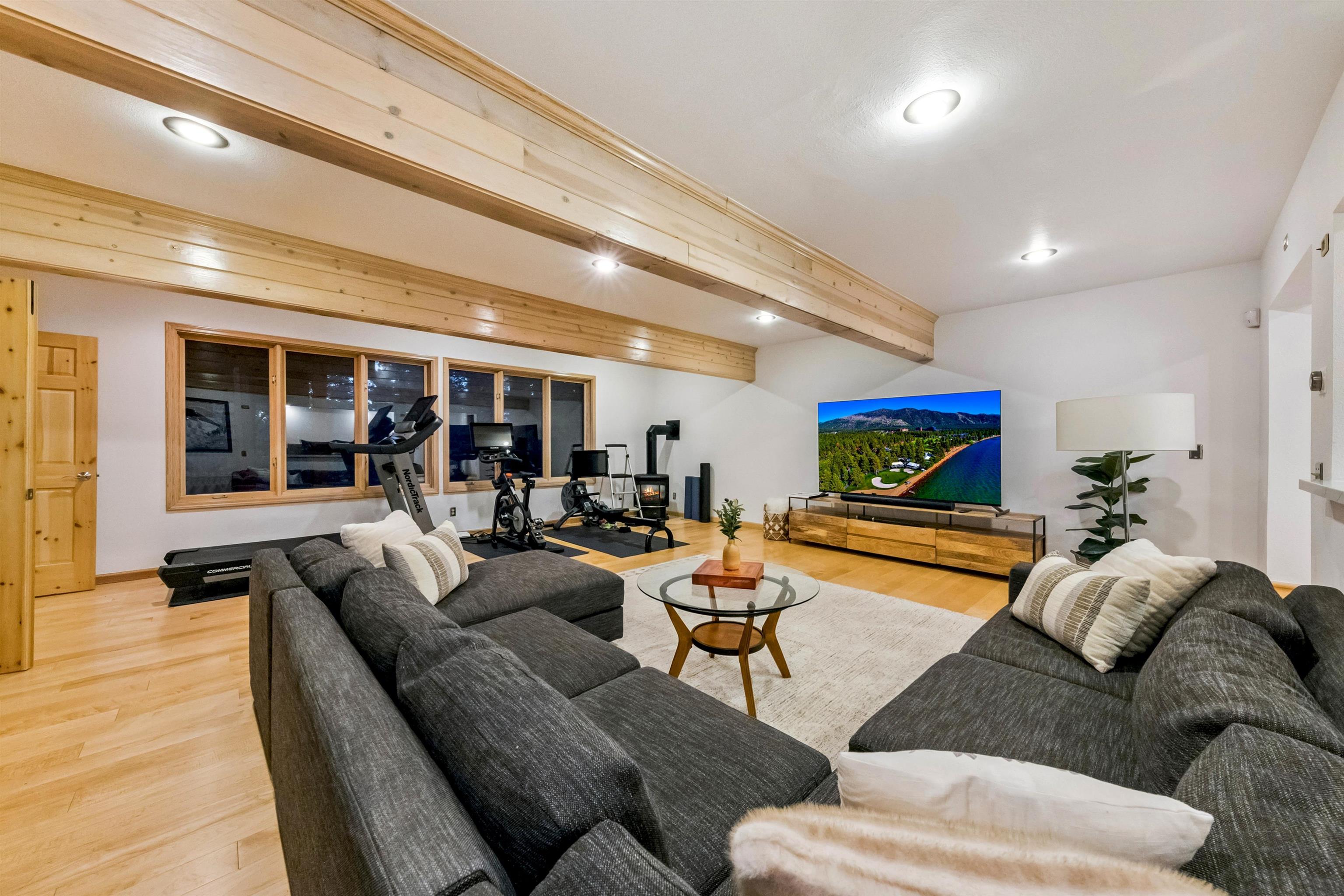 12705 Falcon Point Place Truckee, CA 96161 - Photo 21 of 28 a living room with furniture and a wooden floor