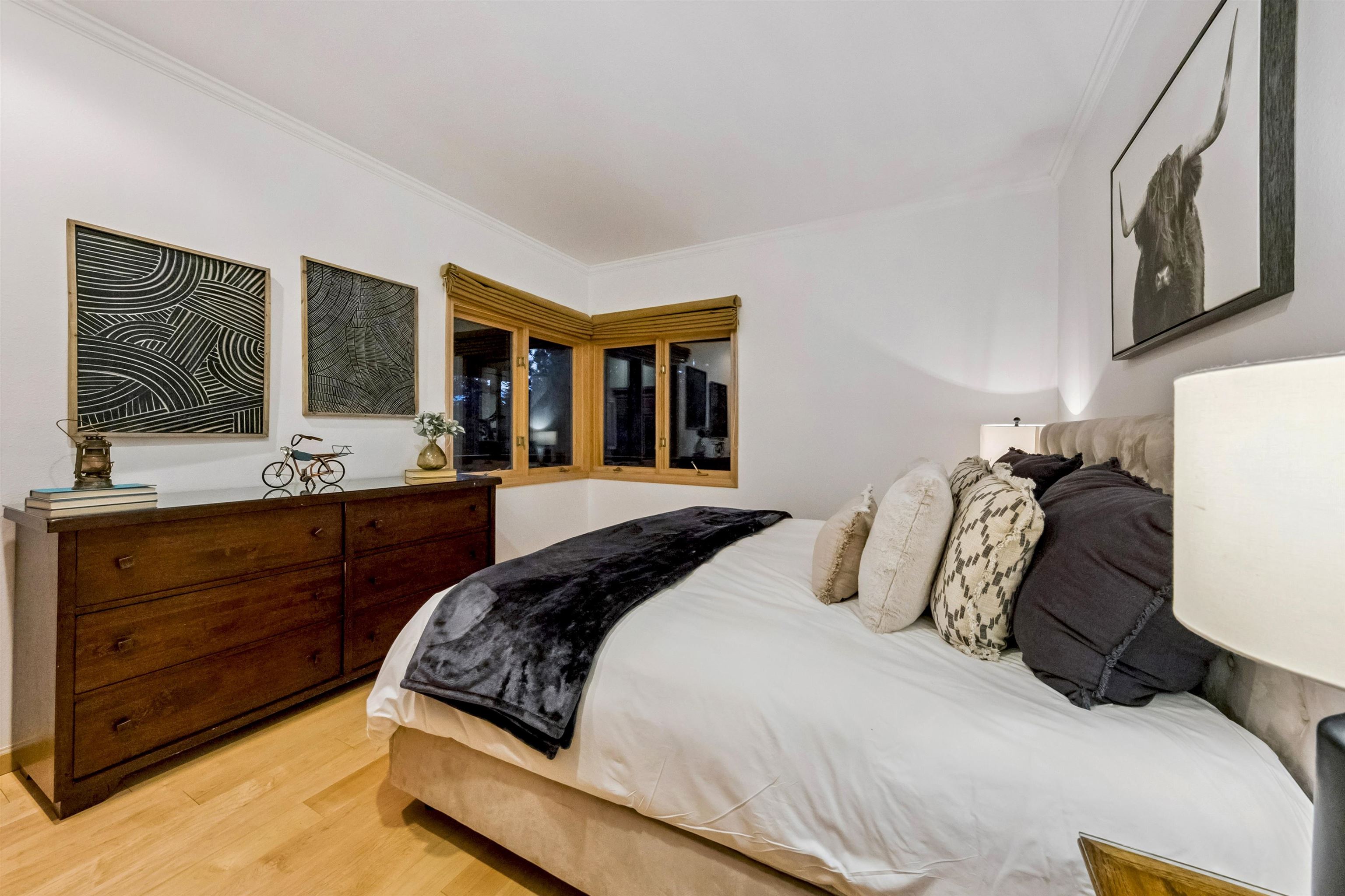 12705 Falcon Point Place Truckee, CA 96161 - Photo 23 of 28 a bedroom with a large bed and a flat tv screen on dresser