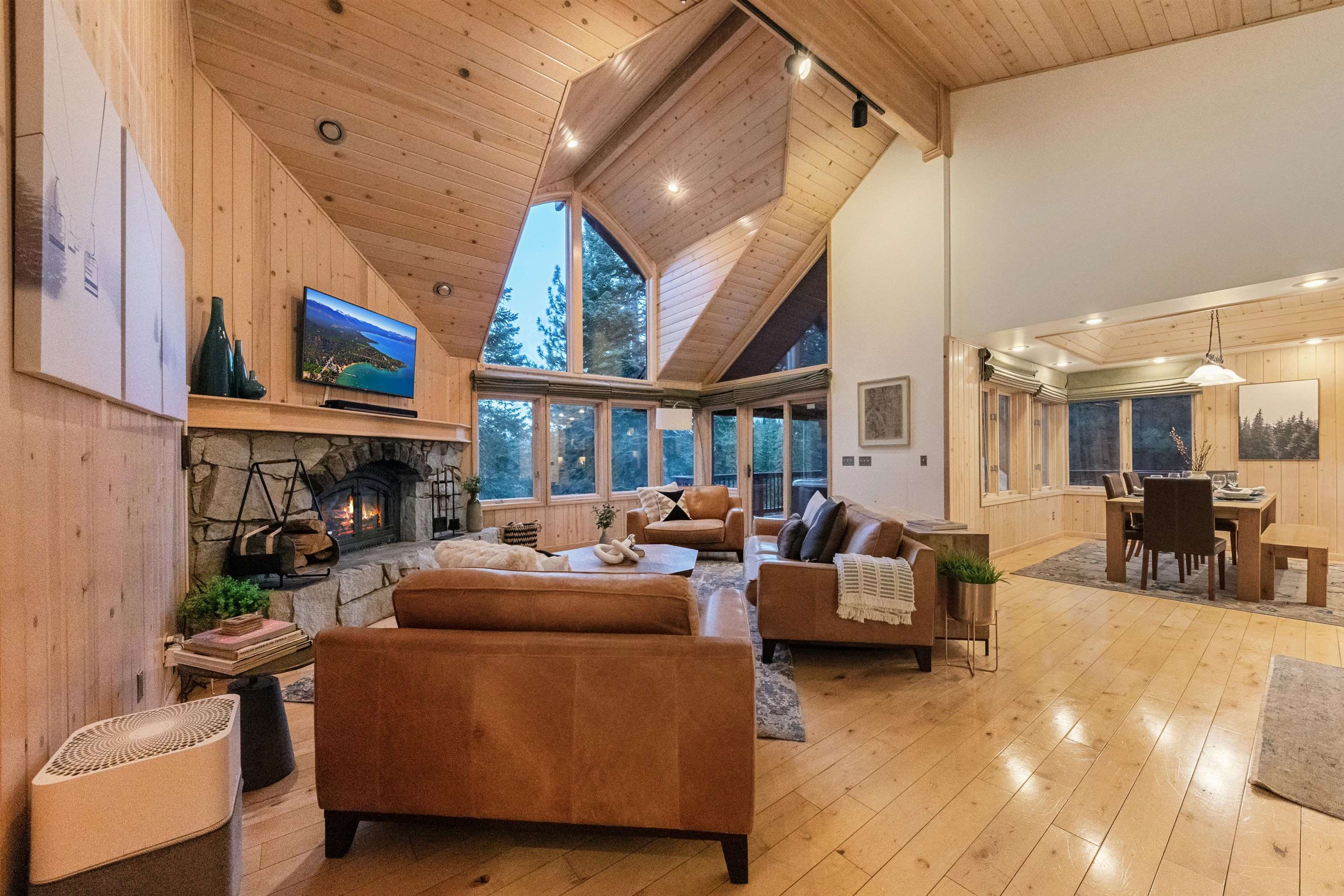 12705 Falcon Point Place Truckee, CA 96161 - Photo 4 of 28 a living room with furniture a fireplace and a flat screen tv