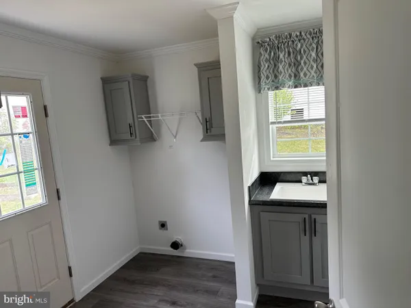 a room with a window and wooden floor