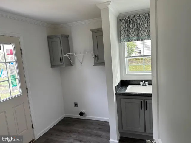 a room with a window and wooden floor