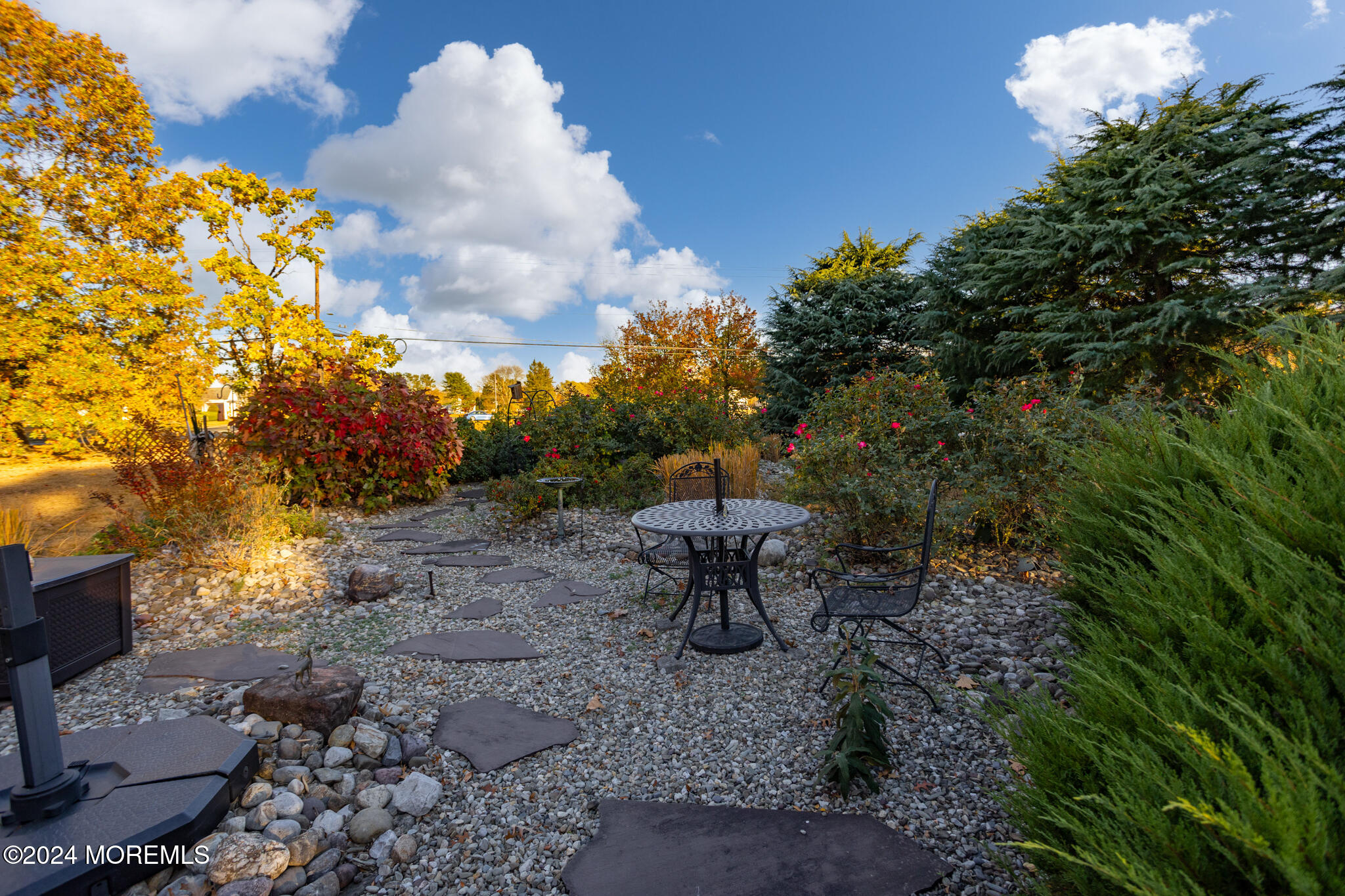 2149 Jacksonville Jobstown Road Jobstown, NJ 08041 - Photo 38 of 48 a view of a backyard with table and chairs and a fire pit