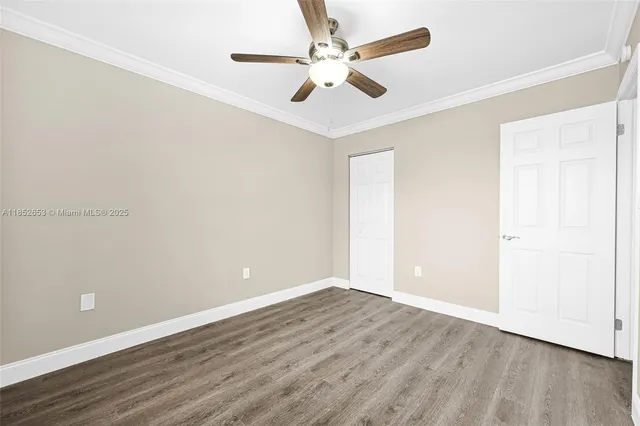 a bathroom with a white bath tub a toilet and a shower