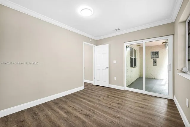 a view of porch with a small yard