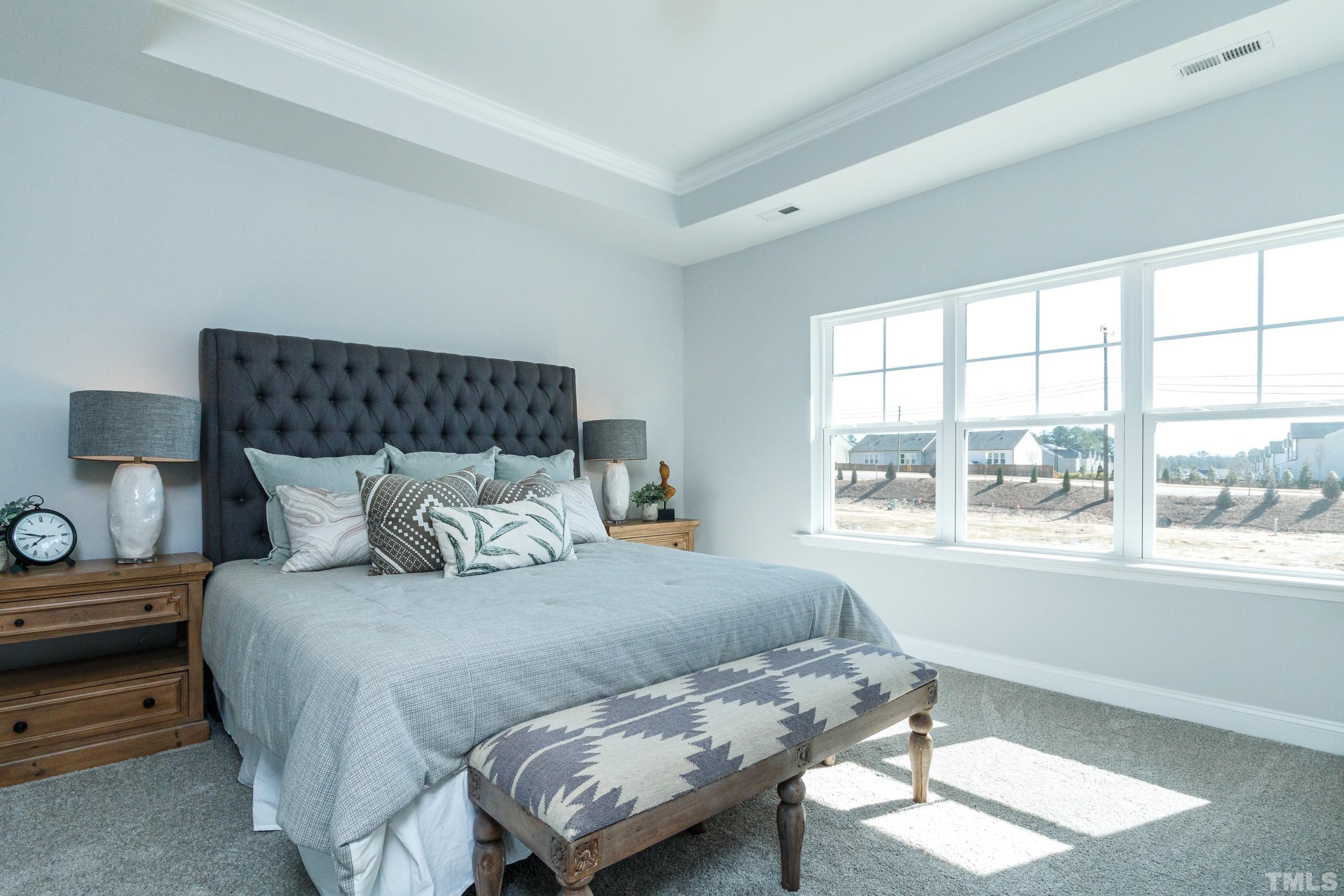 3109 Dunnock Drive, Unit 5 Durham, NC 27713 - Photo 12 of 25 a bedroom with a bed and a window