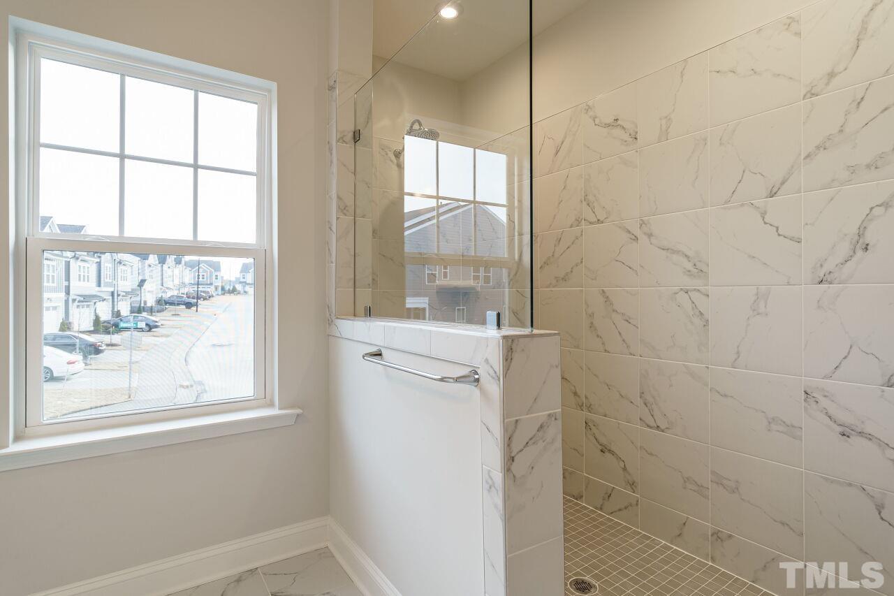 3109 Dunnock Drive, Unit 5 Durham, NC 27713 - Photo 15 of 25 a bathroom with a shower and a sink