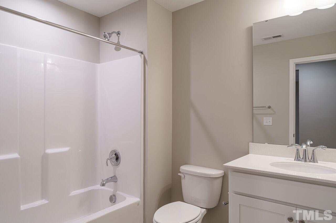 3109 Dunnock Drive, Unit 5 Durham, NC 27713 - Photo 17 of 25 a bathroom with a sink toilet and shower