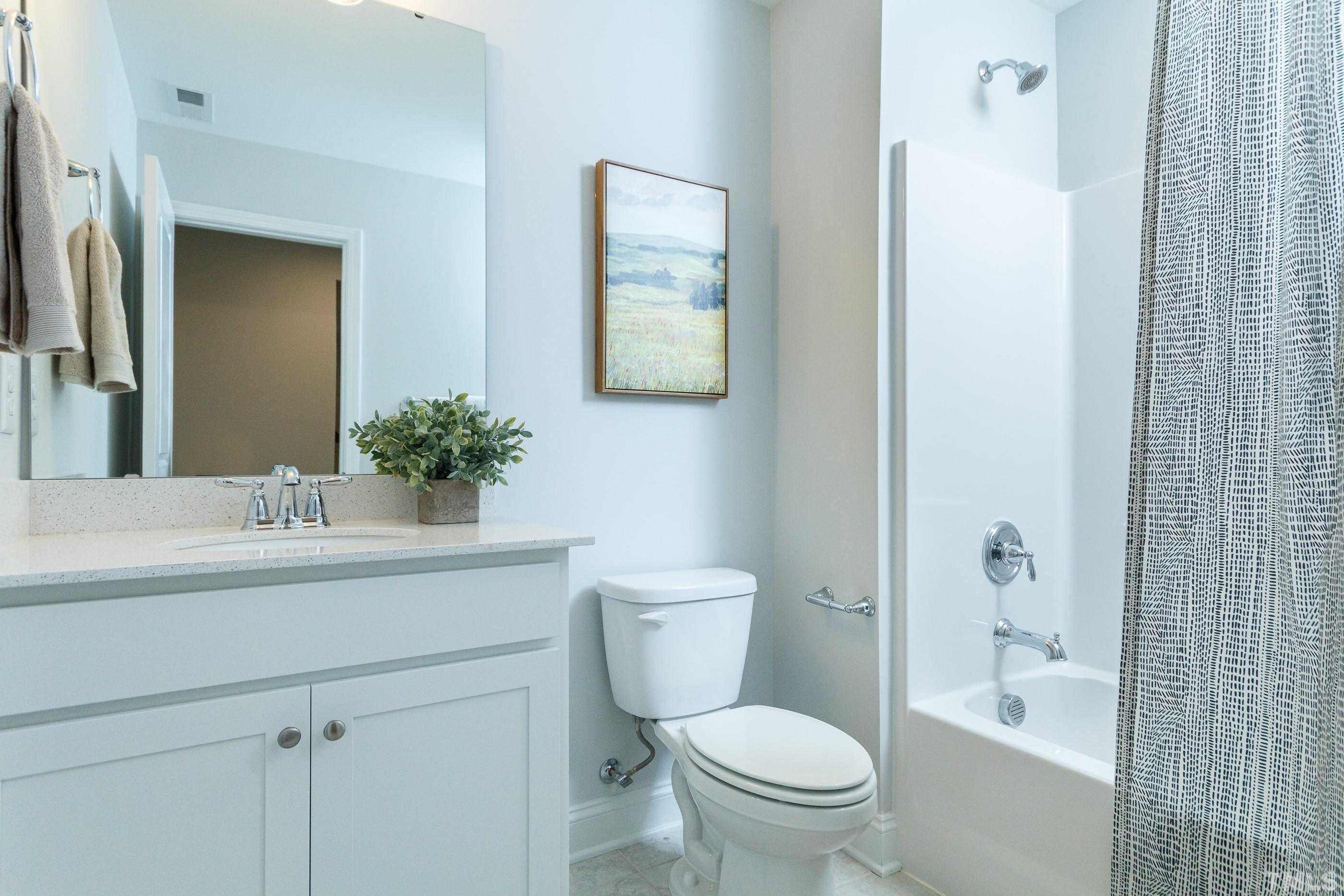 3109 Dunnock Drive, Unit 5 Durham, NC 27713 - Photo 20 of 25 a bathroom with a sink toilet and shower