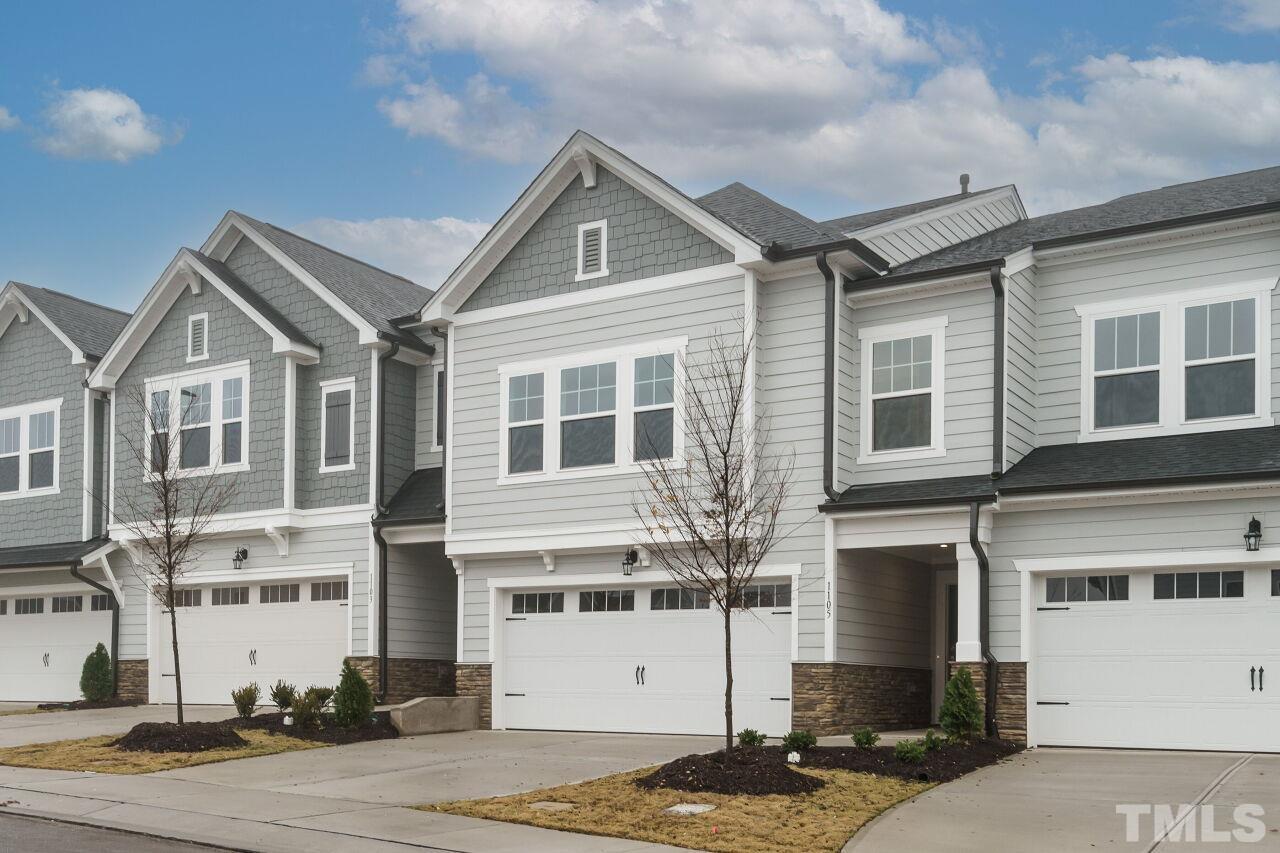 3109 Dunnock Drive, Unit 5 Durham, NC 27713 - Photo 3 of 25 a front view of a house with a yard