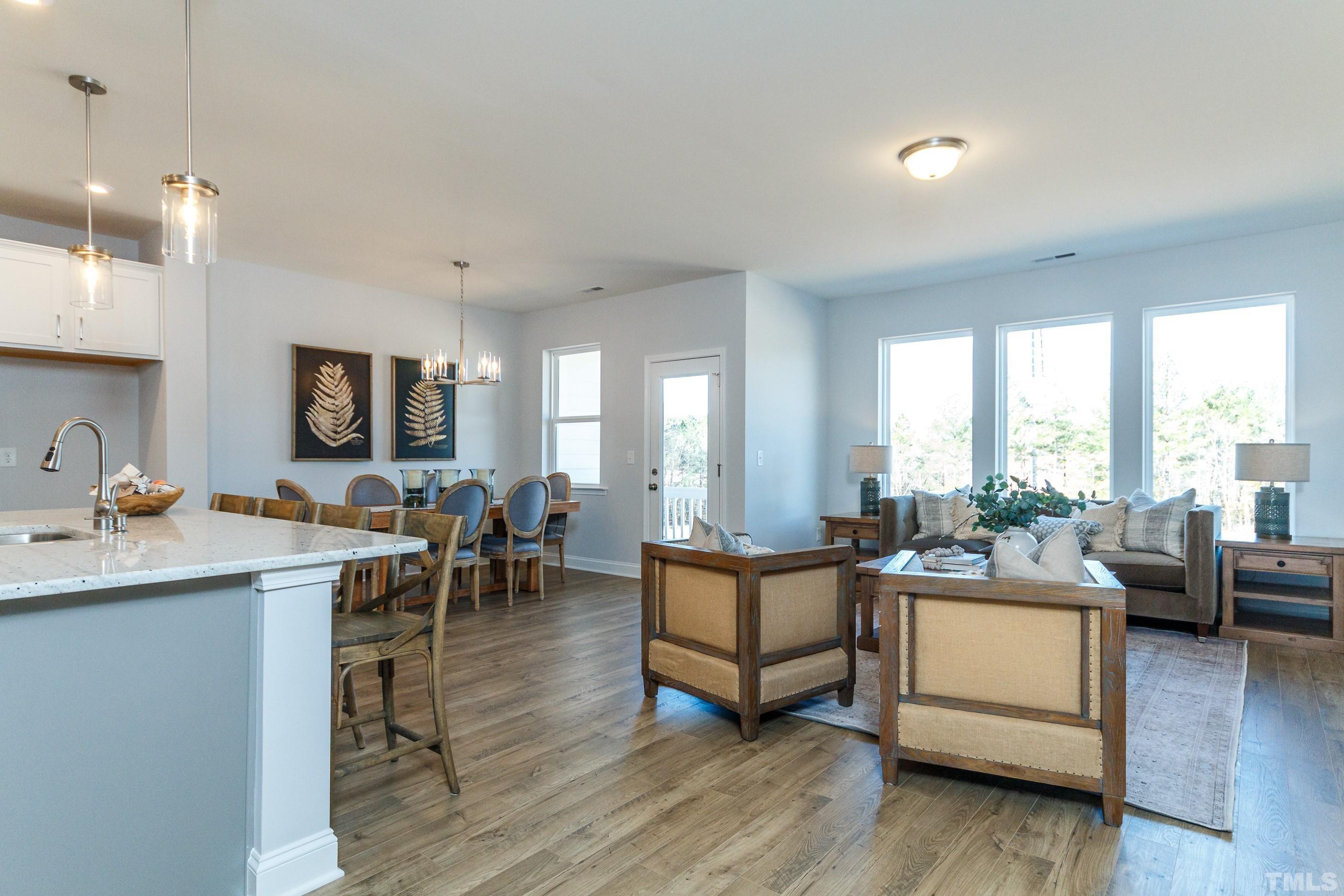 3109 Dunnock Drive, Unit 5 Durham, NC 27713 - Photo 9 of 25 a living room with furniture and a wooden floor