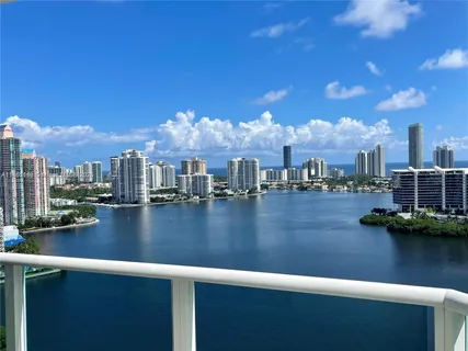 a view of water with boats and city
