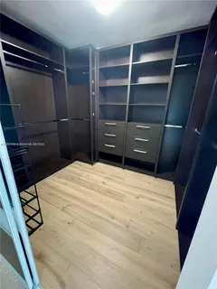 a bedroom with a bed and a closet