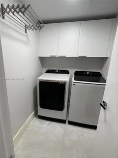 a utility room with washer and dryer
