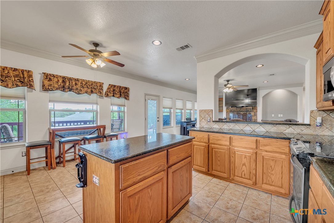 4945 Water Works Road Belton, TX 76513 - Photo 11 of 36 a dining hall with stainless steel appliances granite countertop a sink and dishwasher