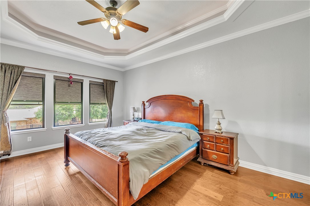 4945 Water Works Road Belton, TX 76513 - Photo 12 of 36 a bed sitting in a bedroom next to a window