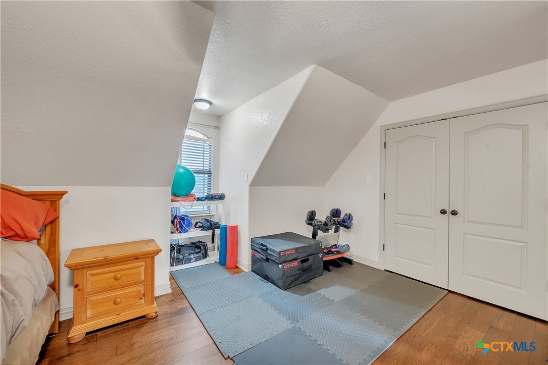 4945 Water Works Road Belton, TX 76513 - Photo 21 of 36 a living room with furniture and a baby crib