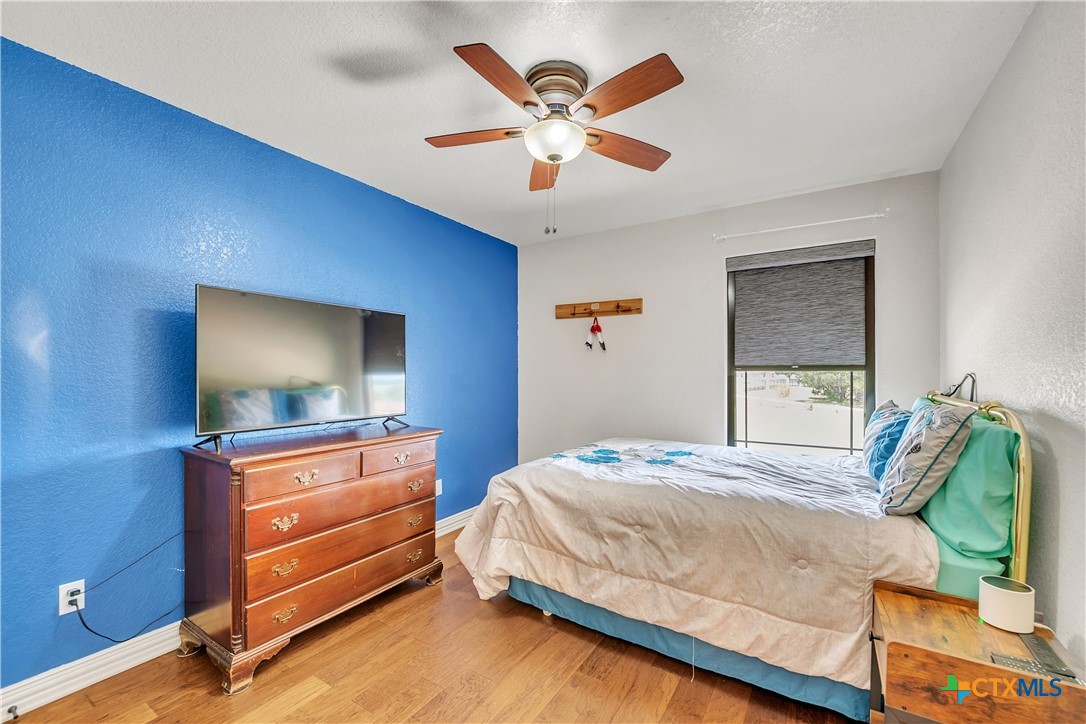 4945 Water Works Road Belton, TX 76513 - Photo 22 of 36 a bedroom with a bed and a flat screen tv
