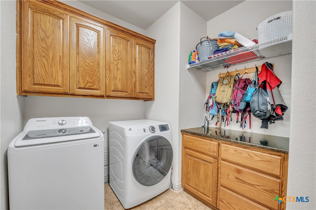4945 Water Works Road Belton, TX 76513 - Photo 26 of 36 a utility room with dryer and washer
