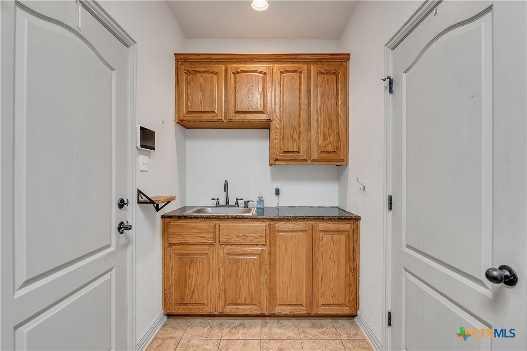 4945 Water Works Road Belton, TX 76513 - Photo 27 of 36 a view of cabinets and wooden cabinets