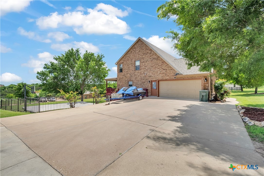 4945 Water Works Road Belton, TX 76513 - Photo 34 of 36 a view of a house with a yard and garage