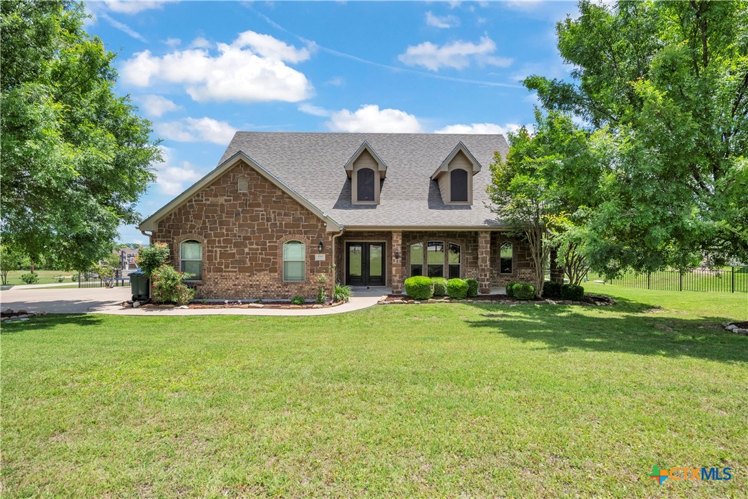 4945 Water Works Road Belton, TX 76513 - Photo 4 of 36 a front view of a house with a garden and porch