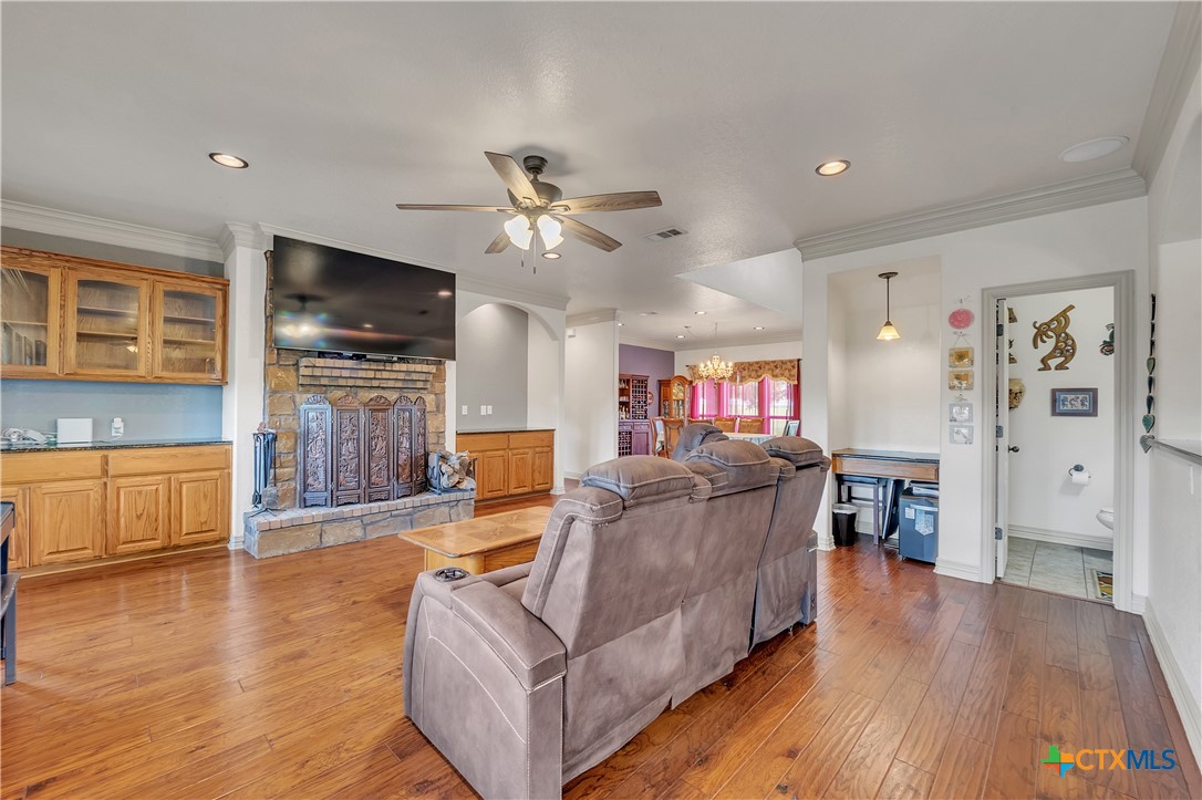 4945 Water Works Road Belton, TX 76513 - Photo 6 of 36 a living room with furniture and a flat screen tv
