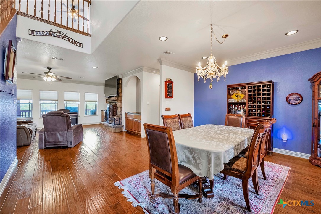 4945 Water Works Road Belton, TX 76513 - Photo 8 of 36 a view of a dining room with furniture and wooden floor