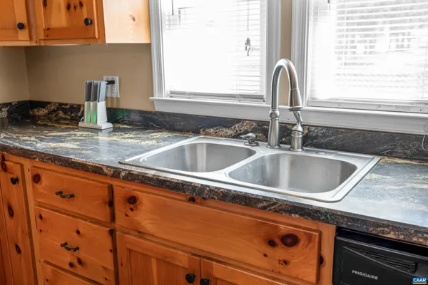 a view of a patio with table and chairs