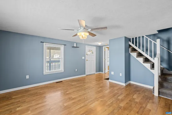 a kitchen with a sink a counter top space and a window