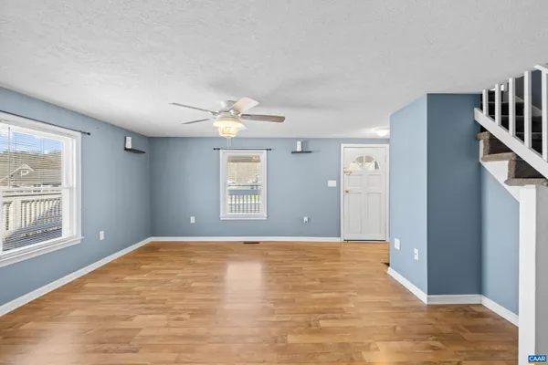 a bathroom with a sink vanity mirror and toilet