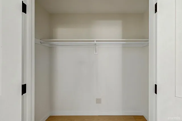 a view of a room with racks on the wall
