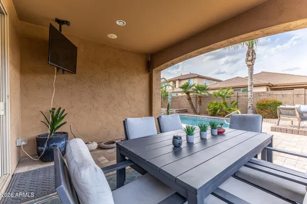 a view of an outdoor dining space with furniture
