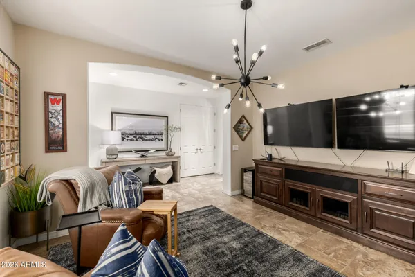 a view of a livingroom with furniture and flat screen tv