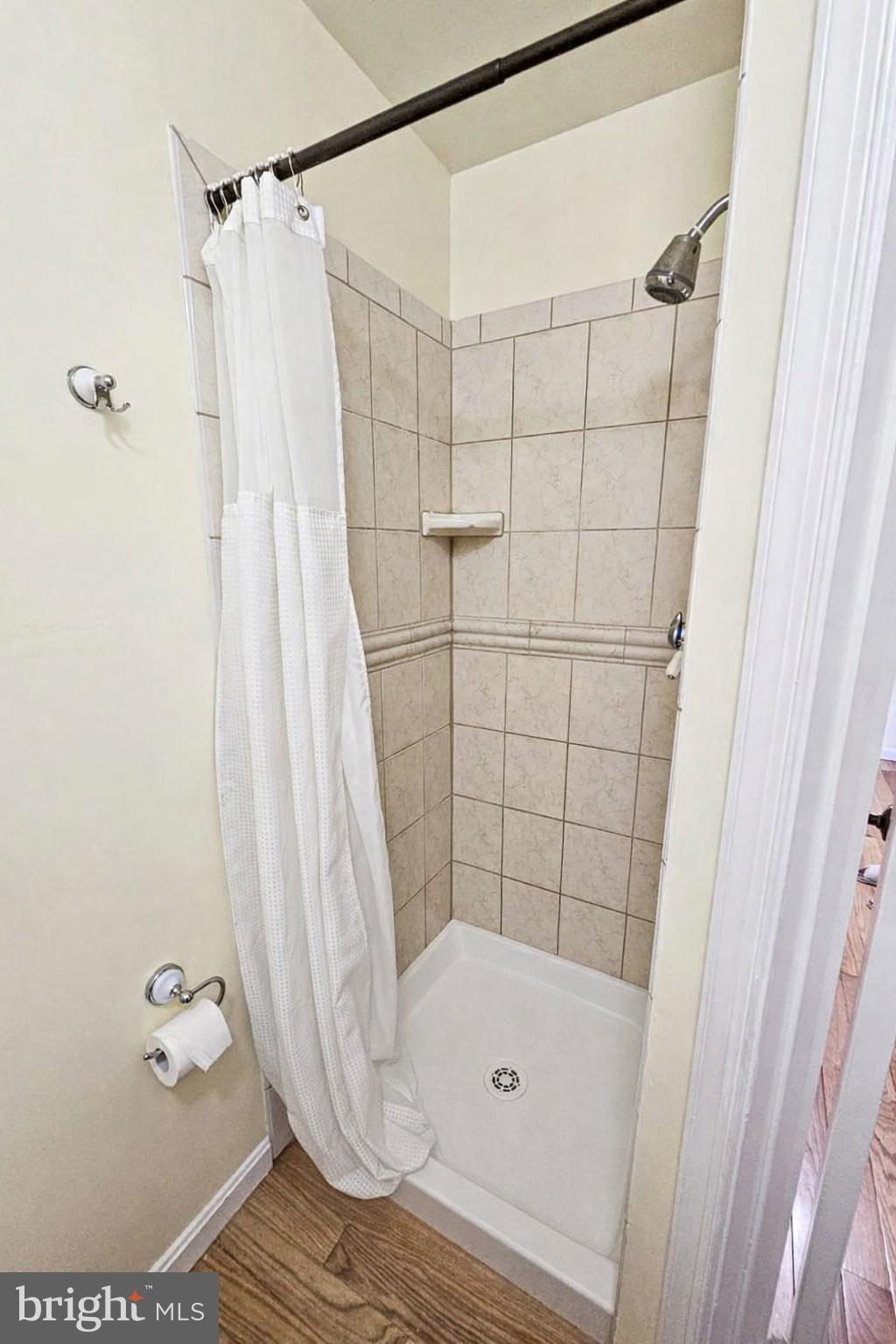 9737 Whiskey Run Laurel, MD 20723 - Photo 12 of 23 a bathroom with a bathtub and shower