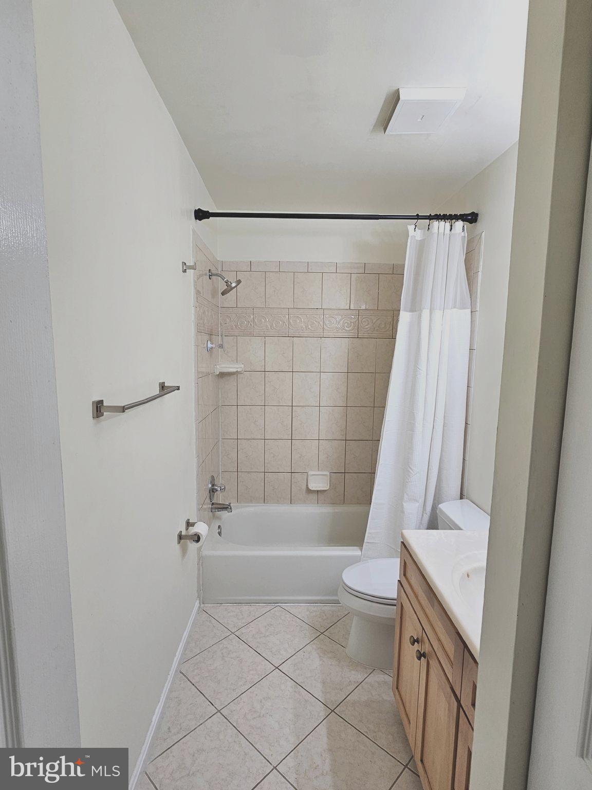 9737 Whiskey Run Laurel, MD 20723 - Photo 15 of 23 a bathroom with a sink a toilet and shower