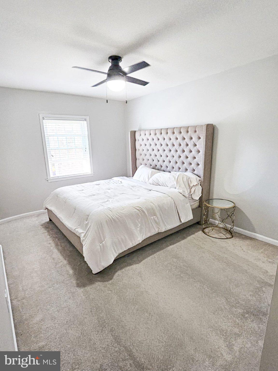 9737 Whiskey Run Laurel, MD 20723 - Photo 17 of 23 a bedroom with a bed and window