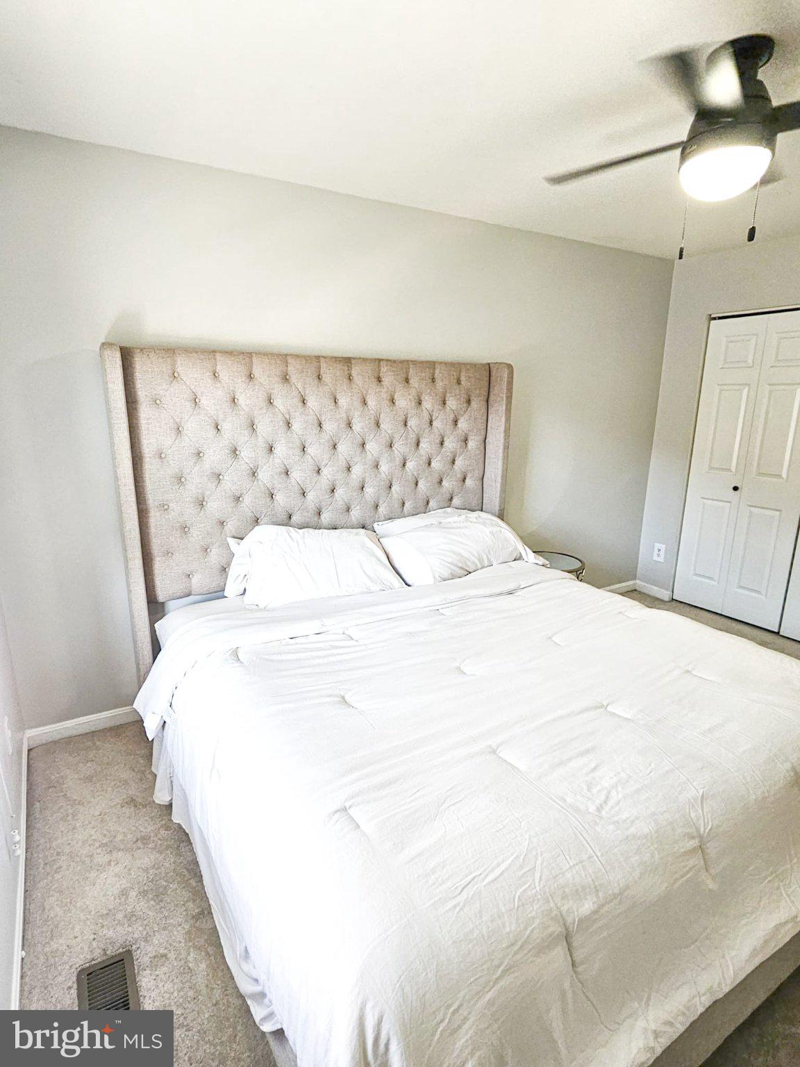 9737 Whiskey Run Laurel, MD 20723 - Photo 18 of 23 a large white bed in a white room