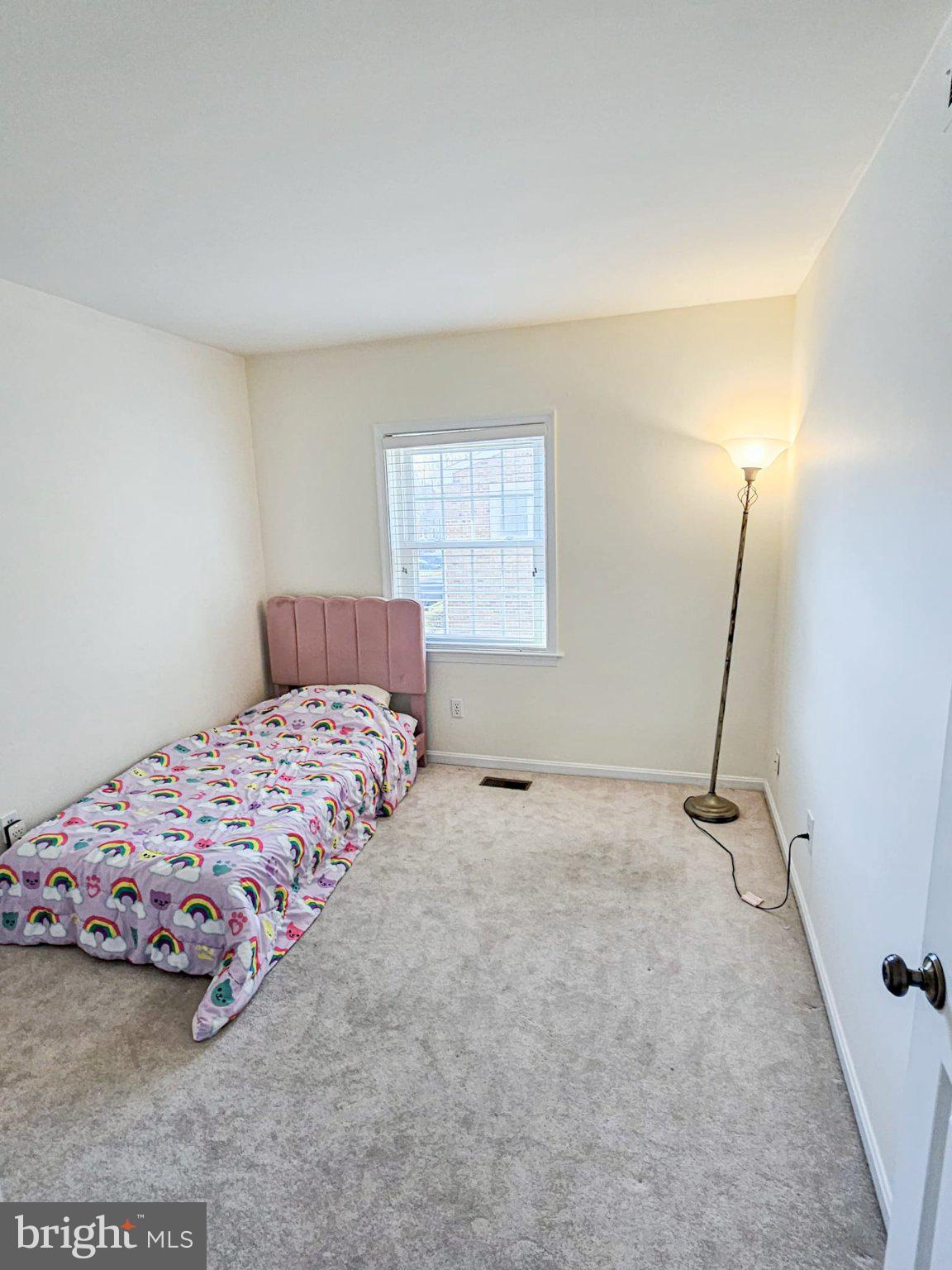 9737 Whiskey Run Laurel, MD 20723 - Photo 19 of 23 a bedroom with a bed and a window