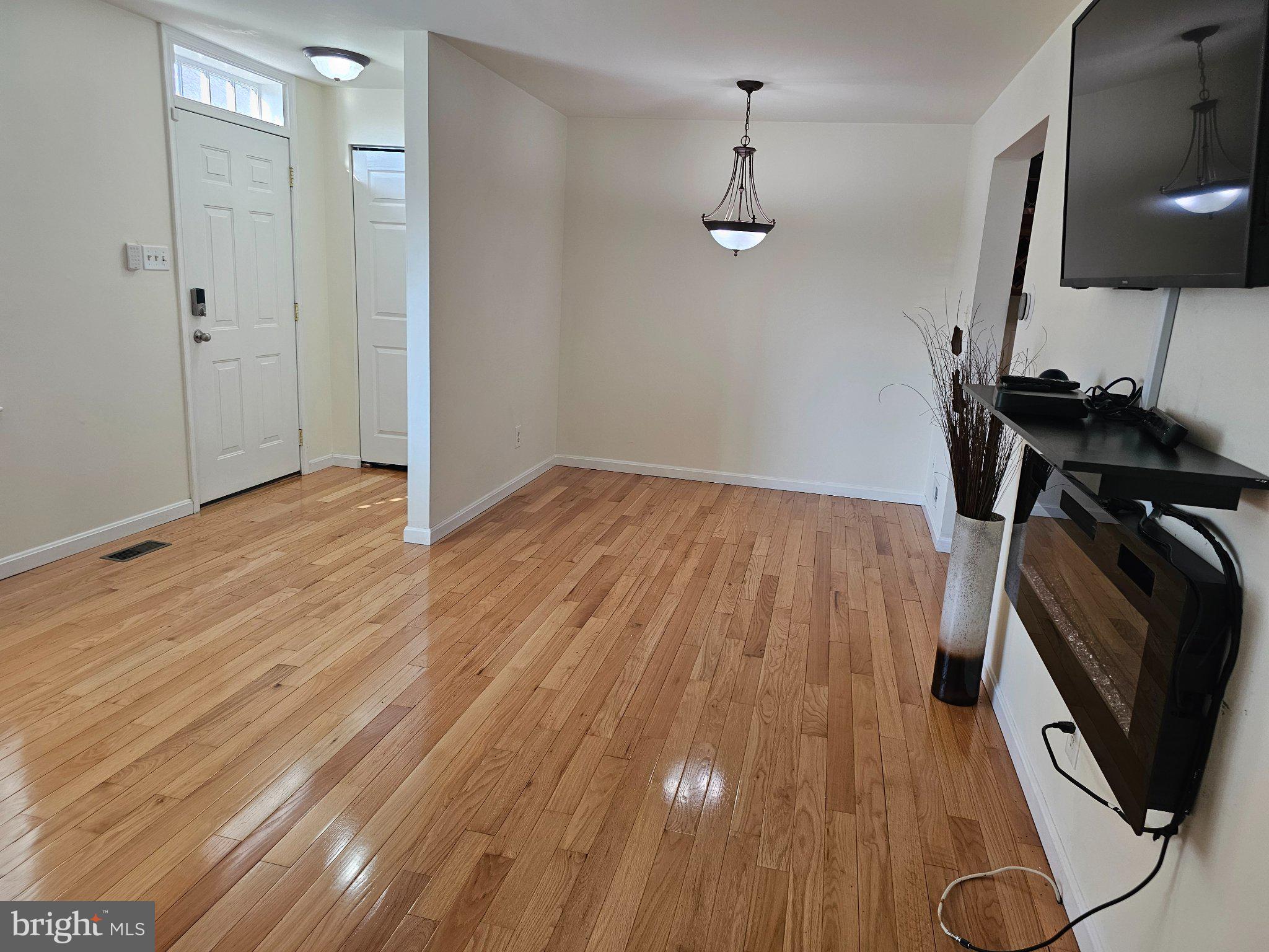 9737 Whiskey Run Laurel, MD 20723 - Photo 5 of 23 wooden floor in an empty room
