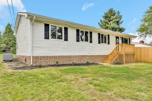 a view of a house with a yard and a window