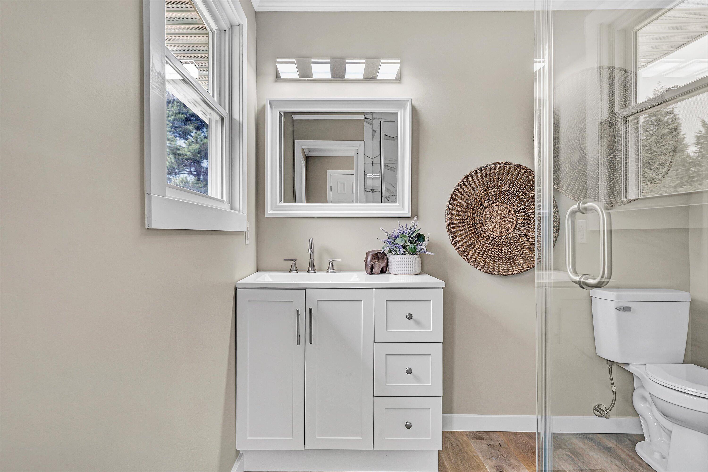 30 Grayson Street Rocky Mount, VA 24151 - Photo 19 of 29 a bathroom with a granite countertop toilet sink and mirror