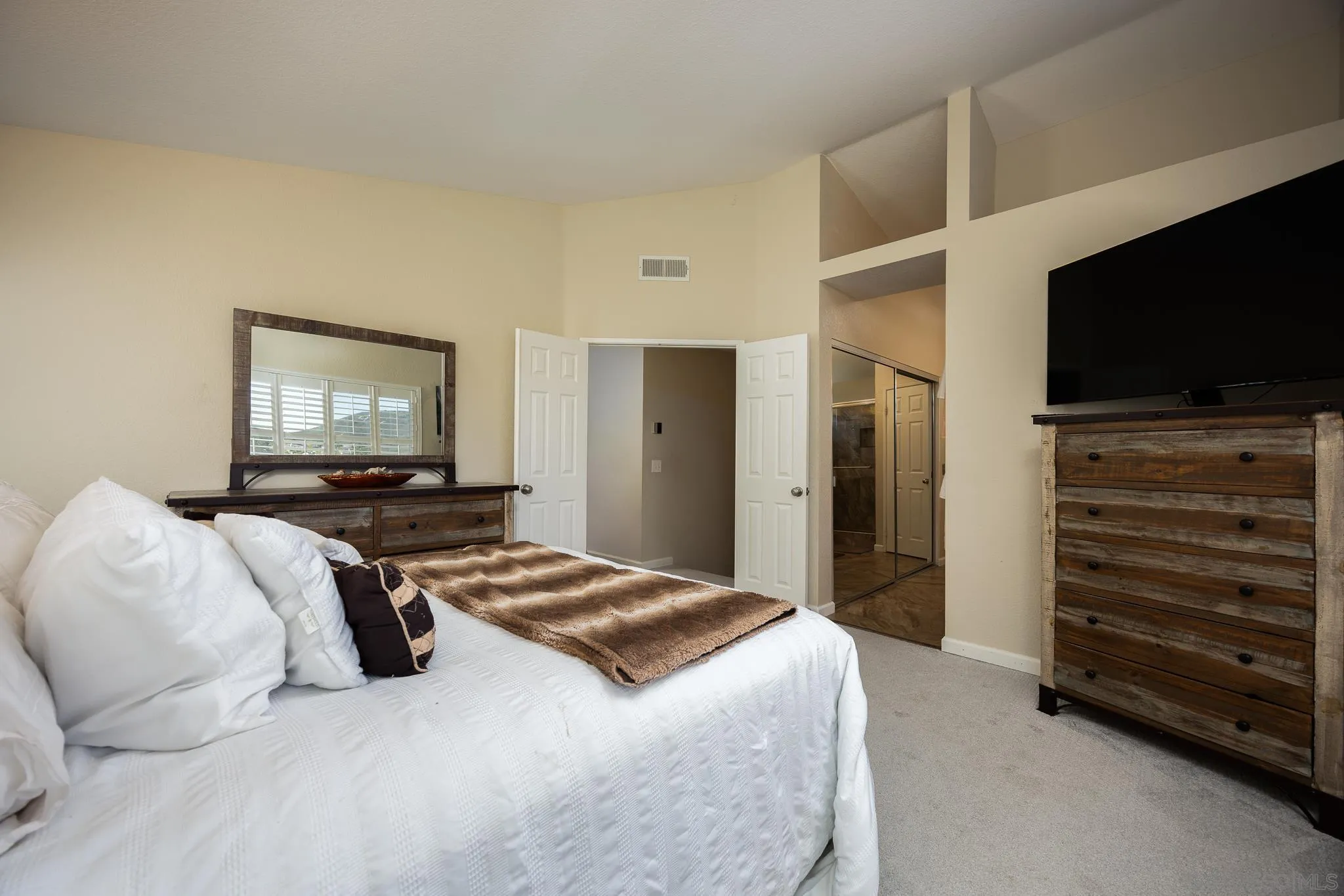 1373 Avenida Azul San Marcos, CA 92069 - Photo 16 of 33 a bedroom with a bed and a flat screen tv