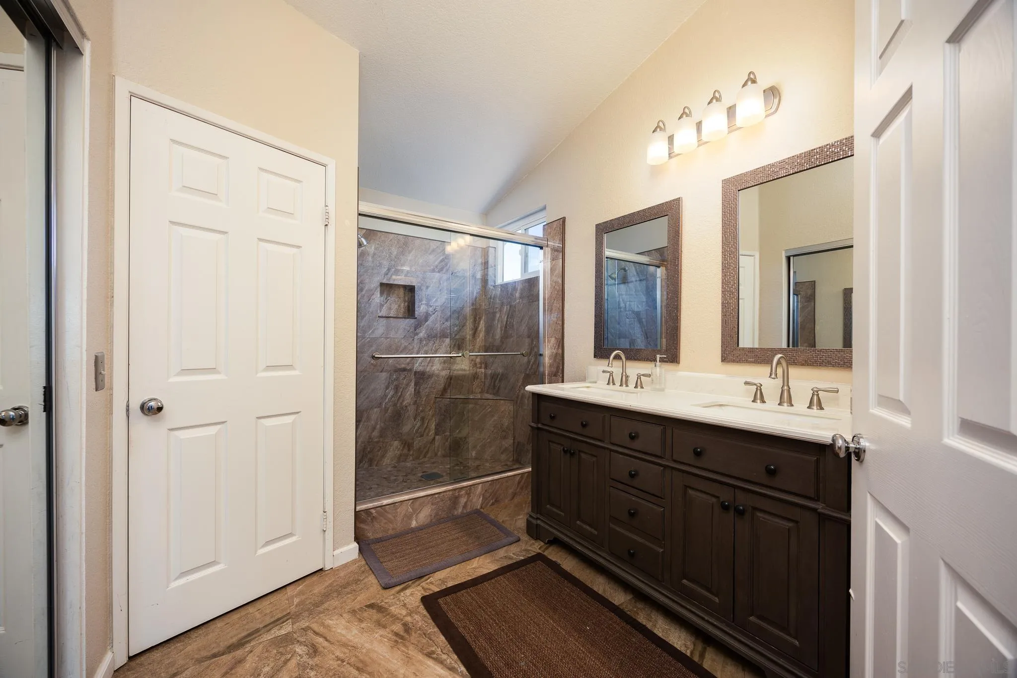 1373 Avenida Azul San Marcos, CA 92069 - Photo 17 of 33 a bathroom with a double vanity sink mirror and shower